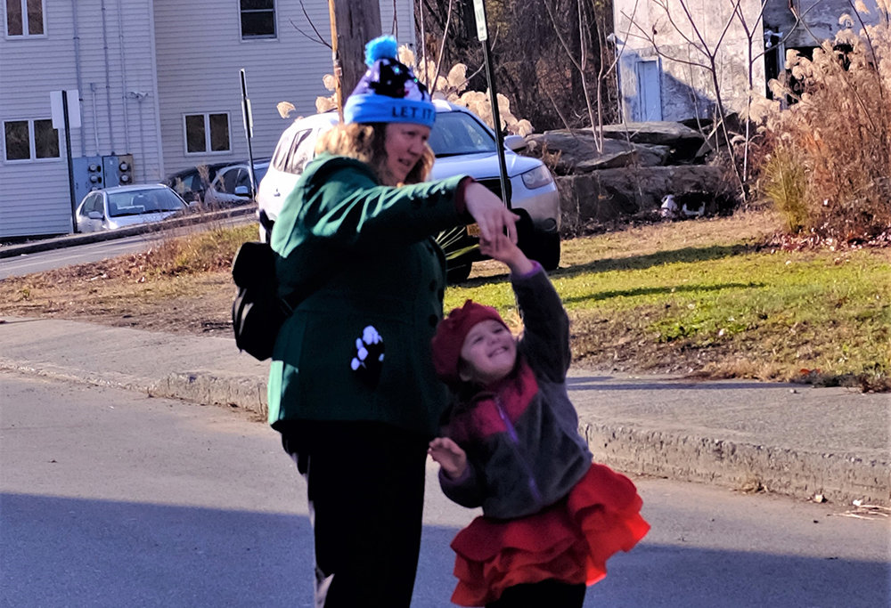 A mother and daughter performed a twirling dance as they waited for Santa’s arrival in the Hamlet of Milton.